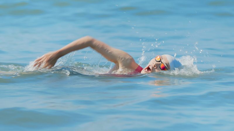 Asian,Woman,Is,Swimming,In,Water,Training,For,Triathlon,At